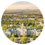 Drone view of the Montana State Capitol, in Helena, on a sunny afternoon with hazy sky caused by wildfires. The Montana State Capitol houses the Montana State Legislature.